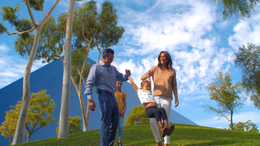 Juan and his wife Amber swinging their daughter, Solana.